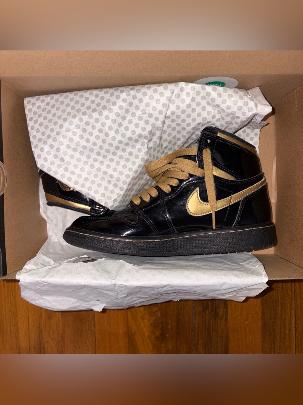 Nike Air Jordan 1 High Black with Metallic Gold Swoosh Limited Edition